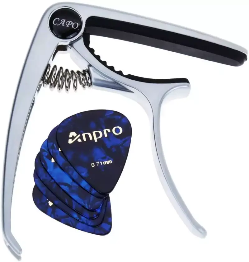 Cejilla para guitarra Anpro + 6 púas Cejilla para guitarra Anpro + 6 púas